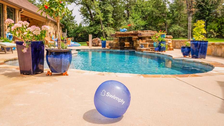 pool with swimply branded beach ball