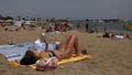 A person reads a book on the Somorrostro Beach in Barcelona, Spain on June 19, 2024. 