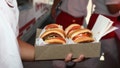 An In-N-Out Burger employee holds up an order on April 23, 2017, in Culver City, California. - Fox News