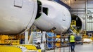 An employee walks past a fuselage section under construction at Boeing&apos;s 787 Dreamliner campus in North Charleston, South Carolina, in May 2023.