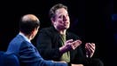 Tesla CEO Elon Musk gestures as he speaks with Michael Milken at the 27th annual Milken Institute Global Conference at the Beverly Hilton in Los Angeles on May 6, 2024.