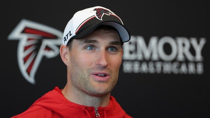 Quarterback Kirk Cousins #18 of the Atlanta Falcons speaks to the media during OTA offseason workouts at the Atlanta Falcons training facility on May 14, 2024 in Flowery Branch, Georgia.