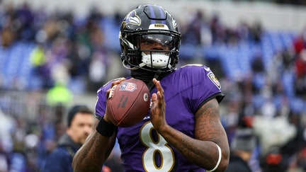 Lamar Jackson #8 of the Baltimore Ravens warms up prior to the AFC Championship NFL football game against the Kansas City Chiefs at M&T Bank Stadium on January 28, 2024 in Baltimore, Maryland.