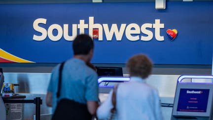 Travelers use a Southwest Airlines Co. self check-in kiosk at Logan International Airport (BOS) in Boston, Massachusetts, U.S., on Friday, July 19, 2019. Southwest Airlines is scheduled to release earnings figures on July 25. Photographer: - Fox Business News