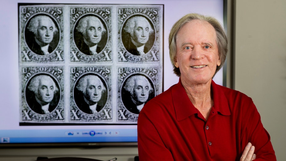 "Bond King" Bill Gross with the 1847 Washington 10-cent stamp in his office in Newport Beach, California, on Oct. 31, 2018.
