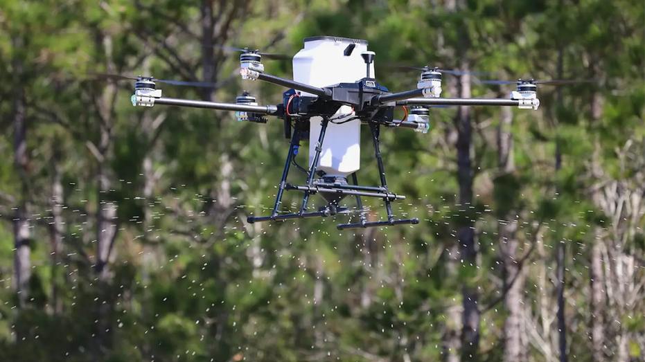 A drone spraying from the air