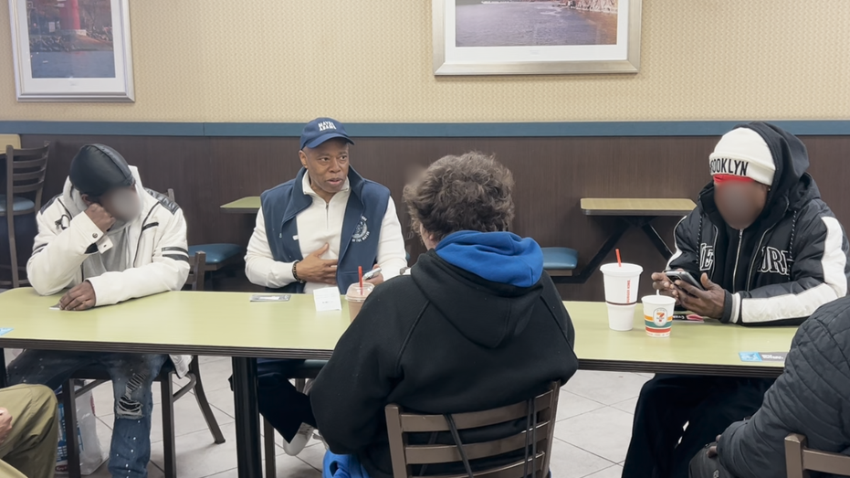 Eric Adams in Burger King speaking to people