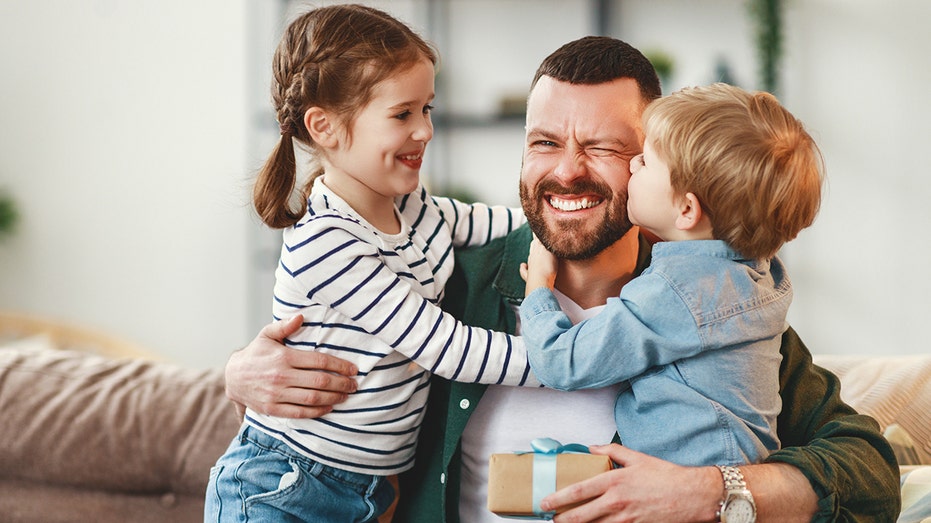 Father and kids hugging on Father's Day