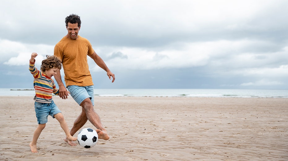 Father and son playing together