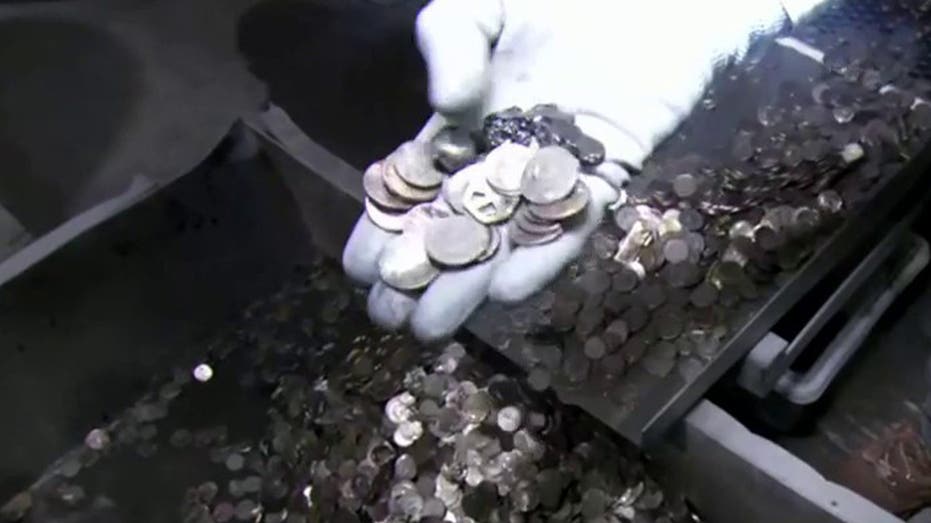 Jeff Flock holding coins