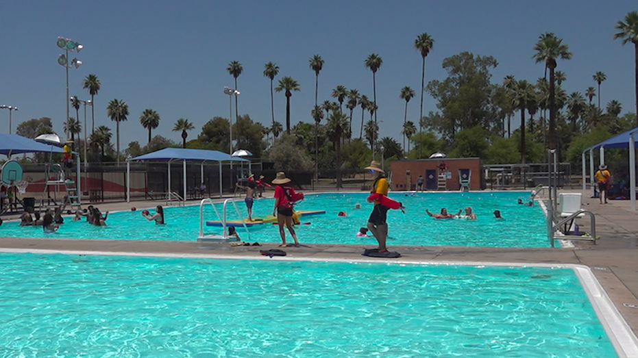 A public swimming pool with people in it