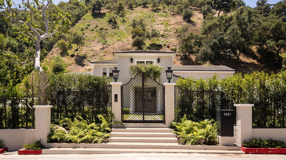 The gate in front of the 6,100 square foot home