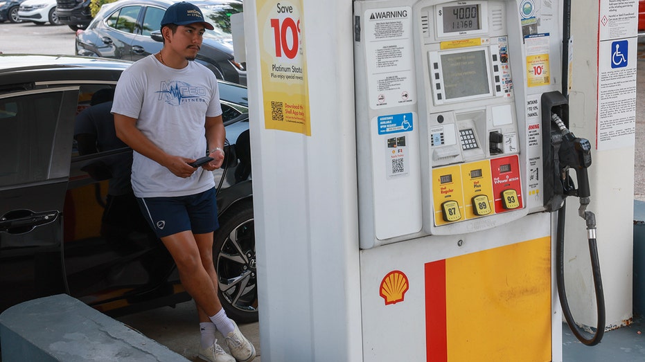A customer pumps gas in Miami