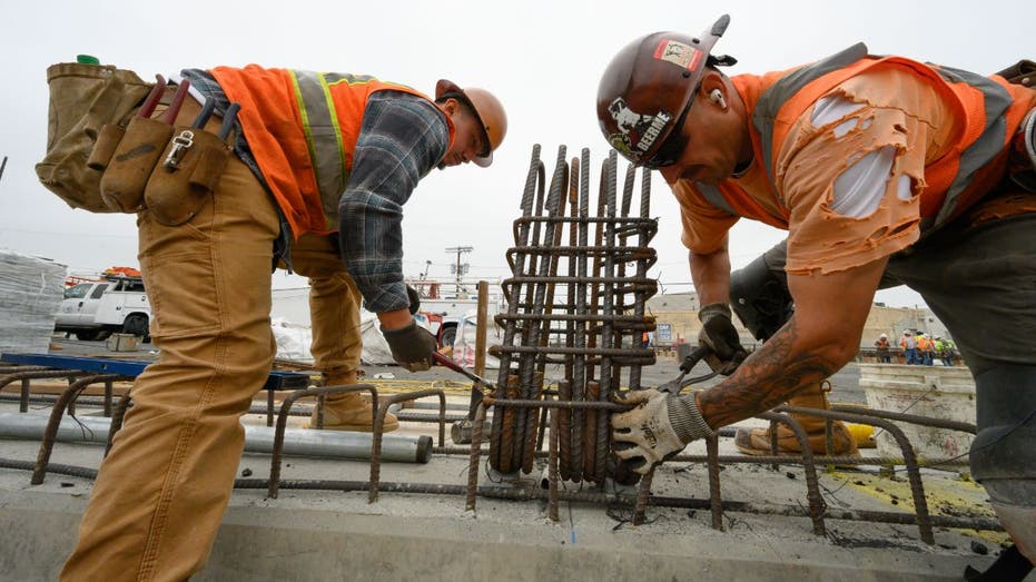 ironworkers installing rebar on a bridge