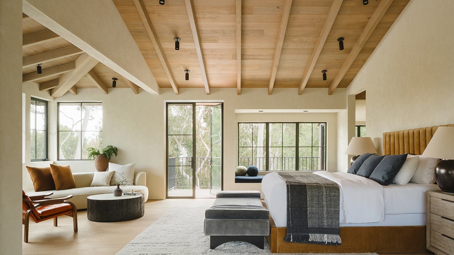 Main bedroom with beams on the ceiling
