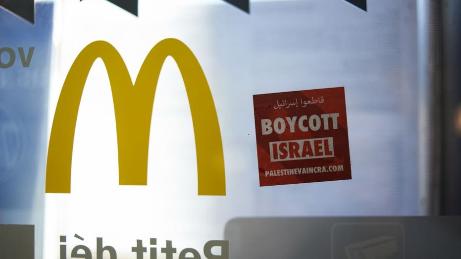 "boycott israel" sign put on a McDonald's window in France