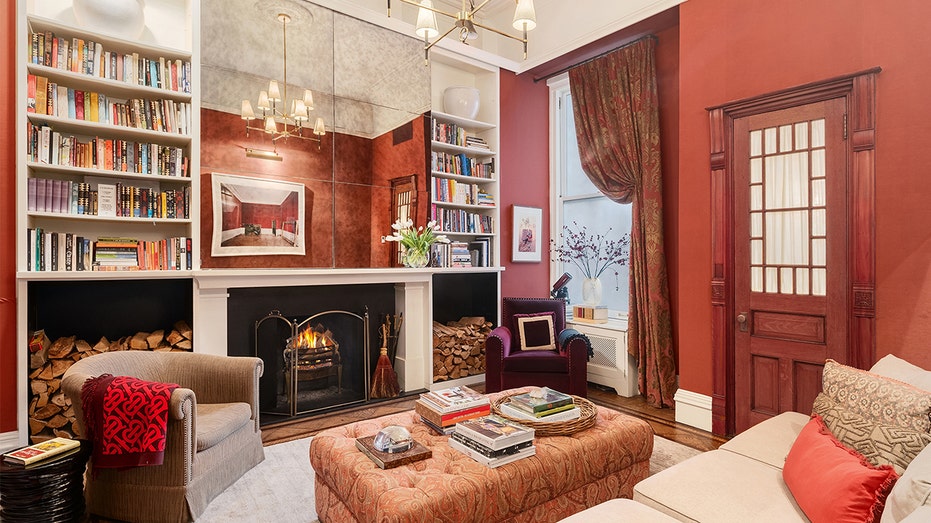 A red library with a fireplace