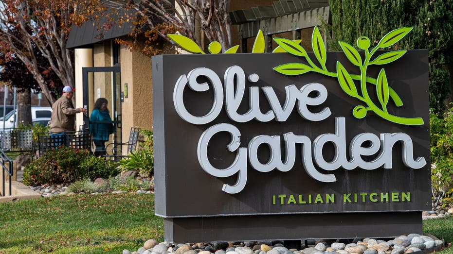 customers walking into an Olive Garden restaurant