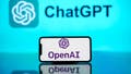 In this photo illustration, the OpenAI logo is seen displayed on a mobile phone screen with ChatGPT logo in the background. - Fox News