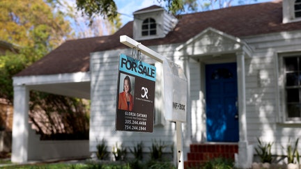 A For Sale sign displayed in front of a home on February 22, 2023 in Miami, Florida. 