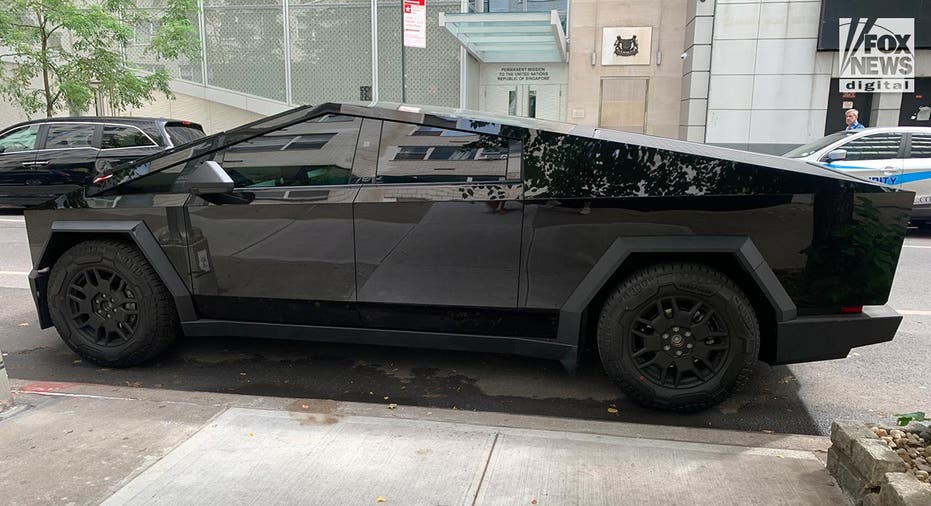 A Tesla Cybertruck is parked on a street in New York City