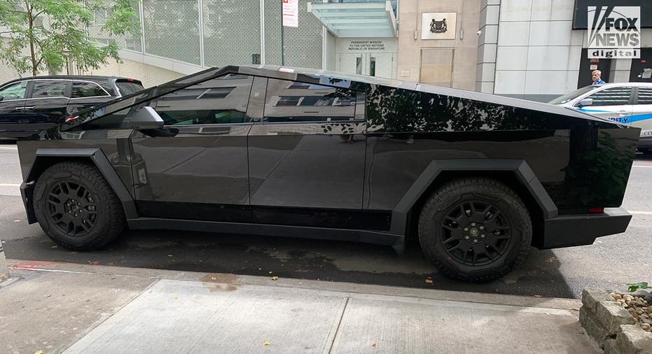 A Tesla Cybertruck is parked on a street in New York City