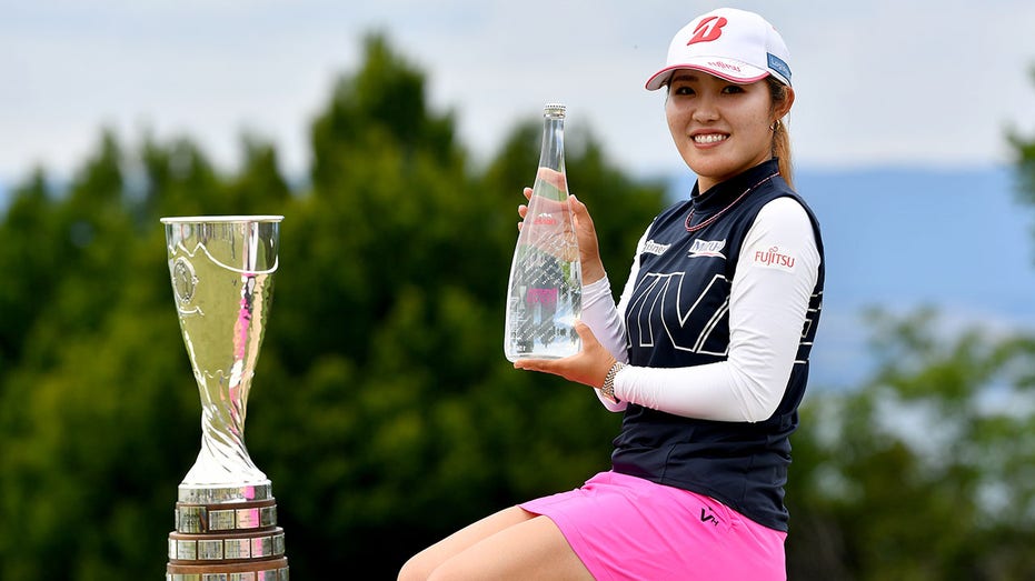 Ayaka Furue holds the trophy