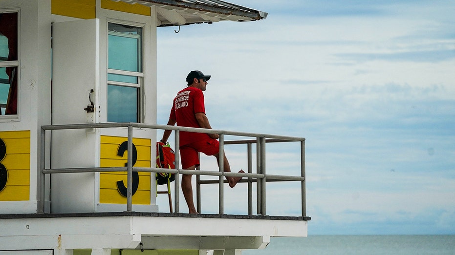 Florida lifeguard looks over beach goers