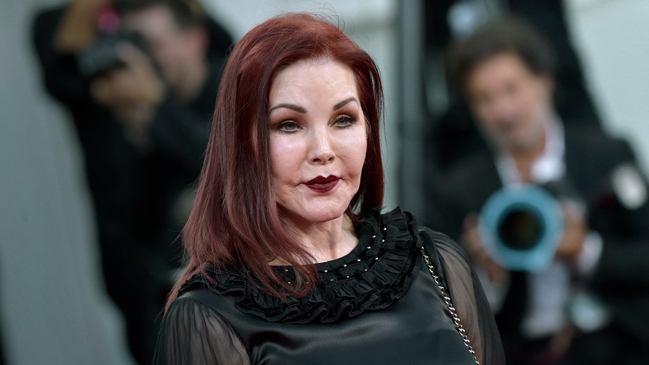 Priscilla Presley wears black to a premiere