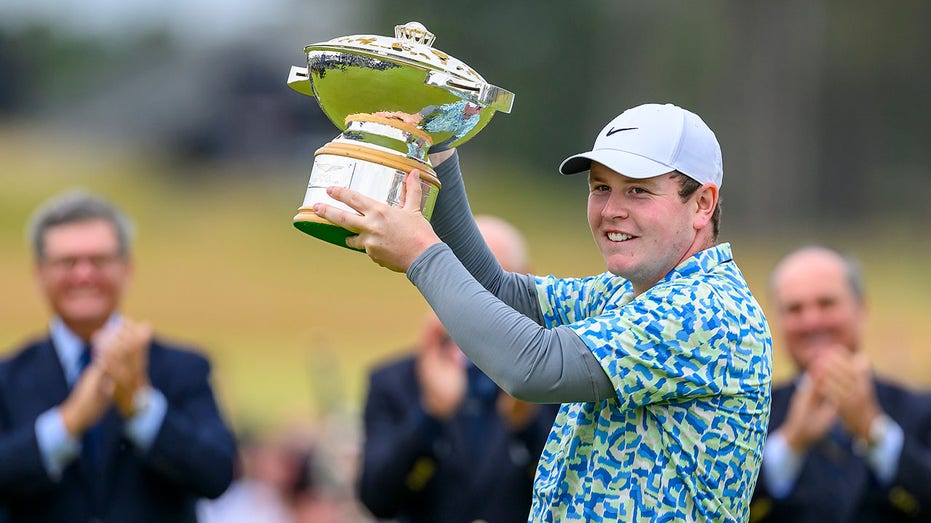 Robert MacIntyre holds the trophy