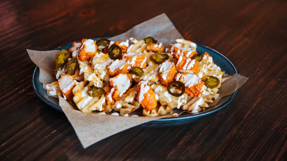 These are the buffalo chicken waffle cheese fries available at Walk-On's Sports Bistreaux for a limited time.