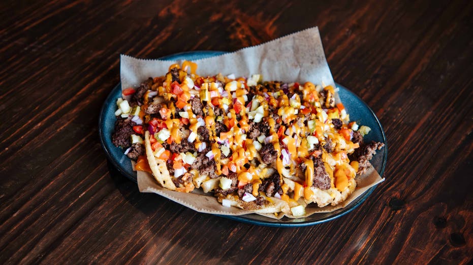 These are the loaded bacon cheeseburger waffle fries available for a limited time at Walk-On's Sports Bistreaux.