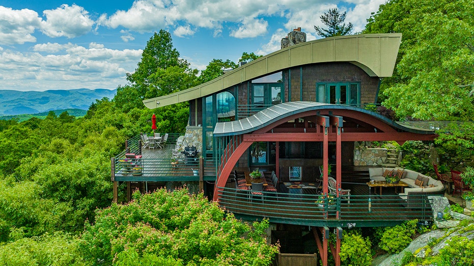 The outside of the home features hues of red and green, making it whimsical.