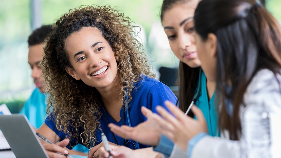 Medical students speaking with each other