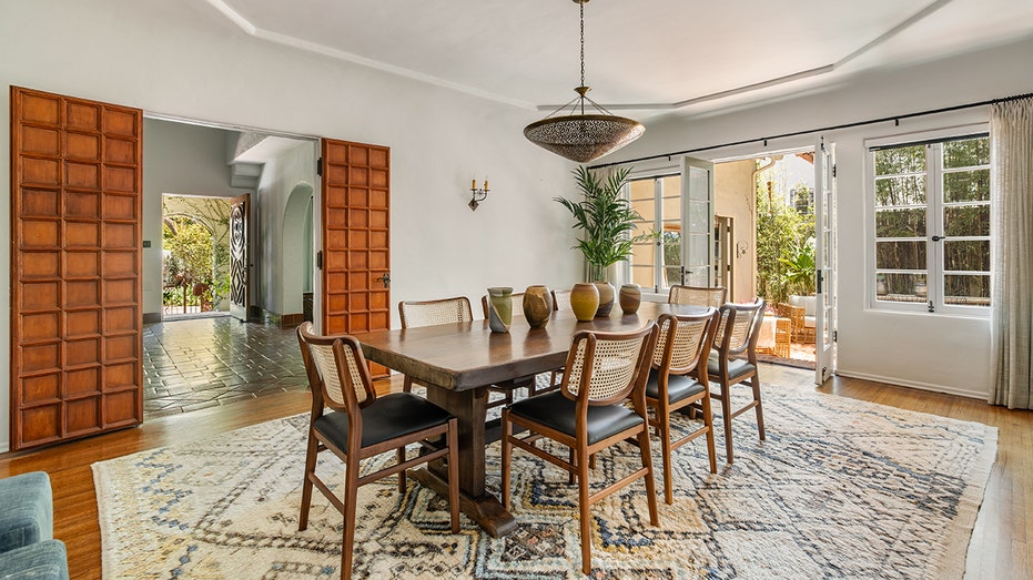 The dining room fits a table for eight people and has direct access to the backyard.