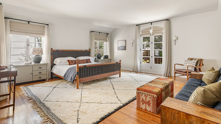 The spacious primary bedroom features a viewing balcony.