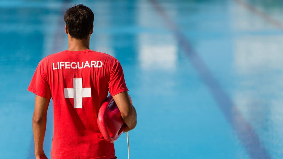 A lifeguard watching over a pool