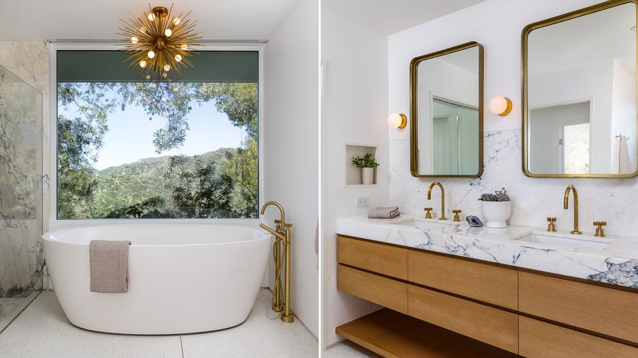 The ensuite bathroom features a large bathtub and two sinks.