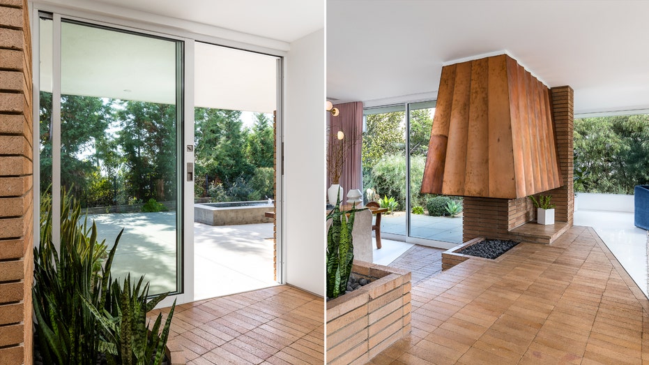 Once inside, the brick flooring continues into the living room and dining room.