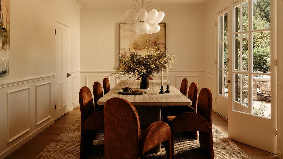 Dining room with a long table and unique light fixture