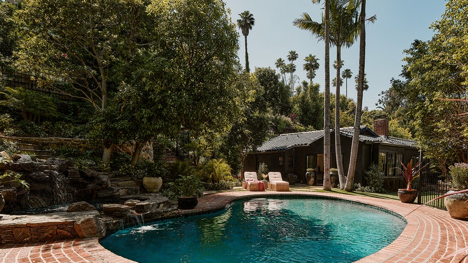 Around the corner from the patio lies a large swimming pool.