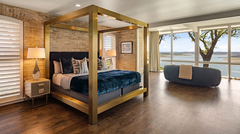 The primary bedroom features a sitting area with views of the lake.