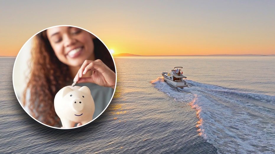 A woman putting a coin in a piggy bang with a boat sailing in the ocean behind her