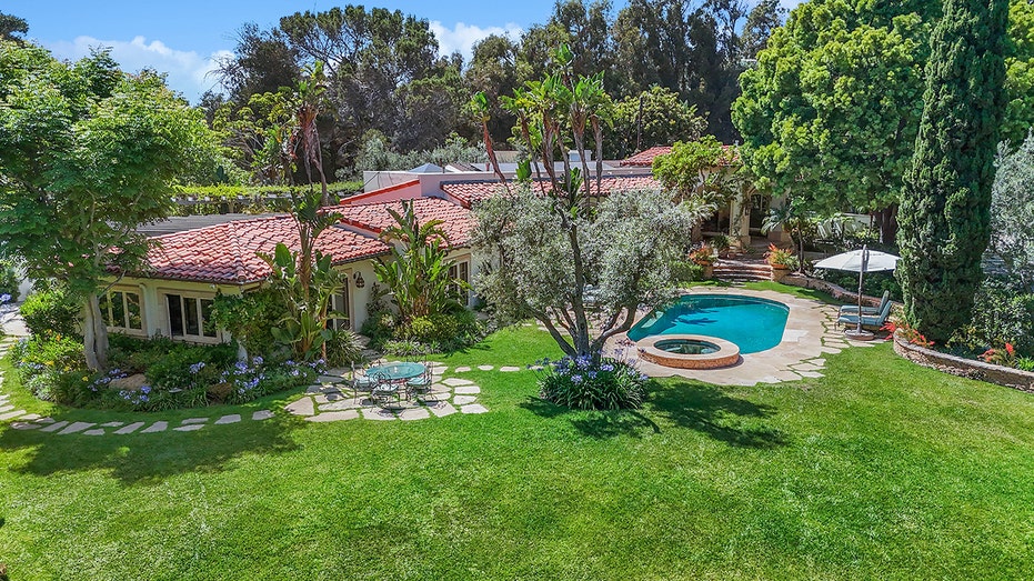 The outside of Petty's home boasts many waterfalls and seating areas.