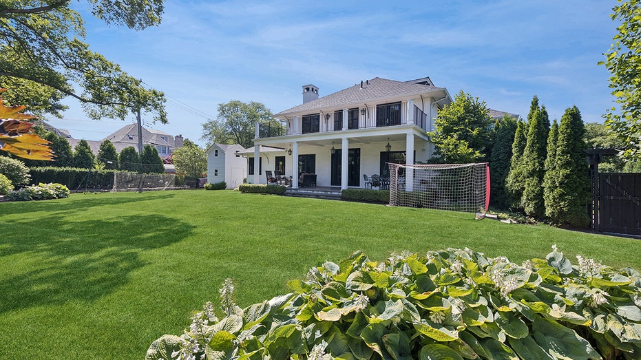 The backyard has plenty of room to add a swimming pool.