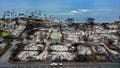 LAHAINA, HAWAII - OCTOBER 09: In an aerial view, a recovery vehicle drives past burned structures and cars two months after a devastating wildfire on October 09, 2023 in Lahaina, Hawaii. The wind-whipped wildfire on August 8th killed at least 98 people while displacing thousands more and destroying over 2,000 buildings in the historic town, most of which were homes. A phased reopening of tourist resort areas in west Maui began October 8th on the two-month anniversary of the deadliest wildfire in modern U.S. history. - Fox News
