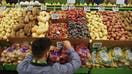 An employee arranges a digital price tag for vegetables on the opening day of the 365 by Whole Foods Market store in the Silver Lake neighborhood of Los Angeles, California, U.S., on Wednesday, May 25, 2016. Whole Foods Market Inc., plans to open 10 of the grocery stores in 2017 with a focus on everyday low prices and convenience.  - Fox Business News