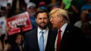 Former US President Donald Trump, right, and Senator JD Vance, a Republican from Ohio and Republican vice-presidential nominee, stand together during a campaign event at Van Andel Arena in Grand Rapids, Michigan, US, on Saturday, July 20, 2024. Trump and running mate Vance are making their campaign-trail debut as the official Republican ticket by returning to one of a trio of key "blue wall" states thats increasingly likely to decide the US election. 