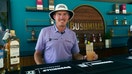 Joel Dahmen poses behind Bushmills pop-up bar