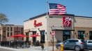 People enjoying the outdoor patio in Shoreview, Minnesota. Chick-fil-A is an American fast food restaurant chain specializing in chicken sandwiches. - Fox Business News